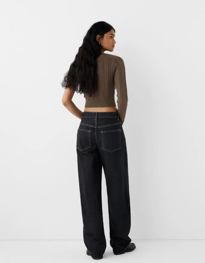 Asymmetric cable-knit sweater