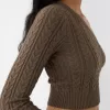 Asymmetric cable-knit sweater
