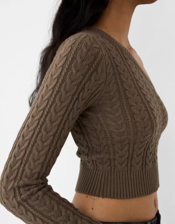 Asymmetric cable-knit sweater