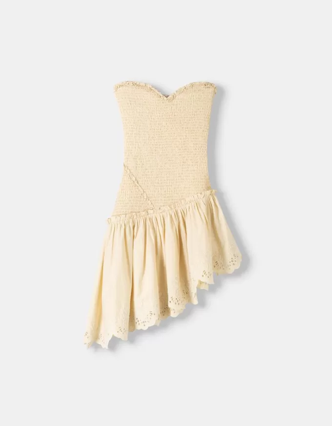 Asymmetric dress with shirred elastic detail