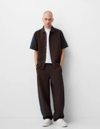 Baggy pants with side stripes