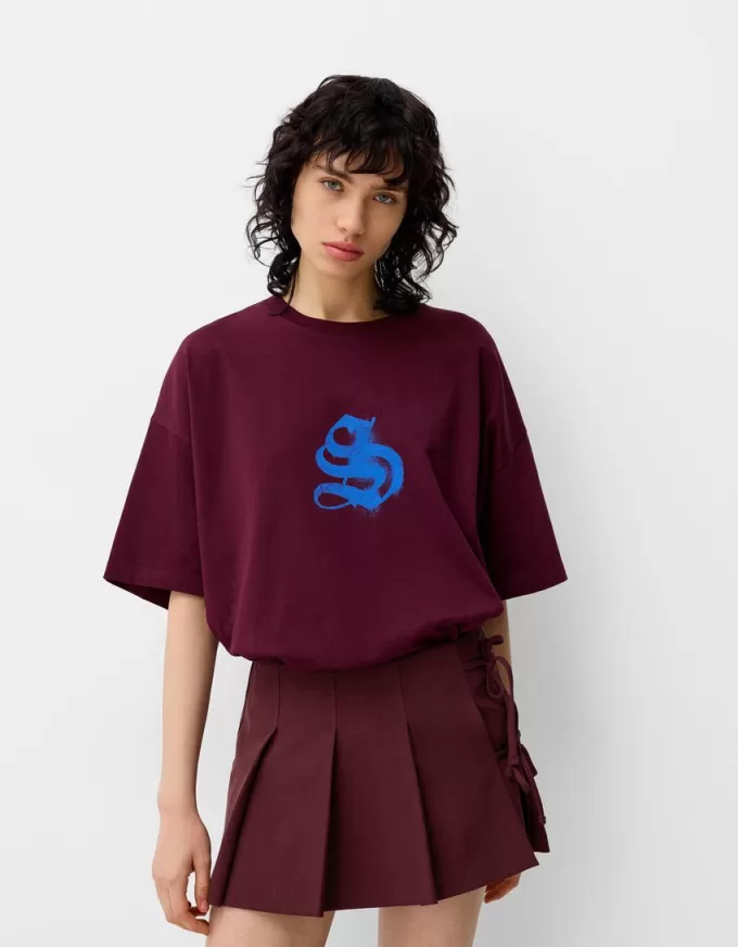 Box pleat mini skirt with bow detail Box pleat mini skirt with bow detail