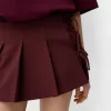 Box pleat mini skirt with bow detail Box pleat mini skirt with bow detail