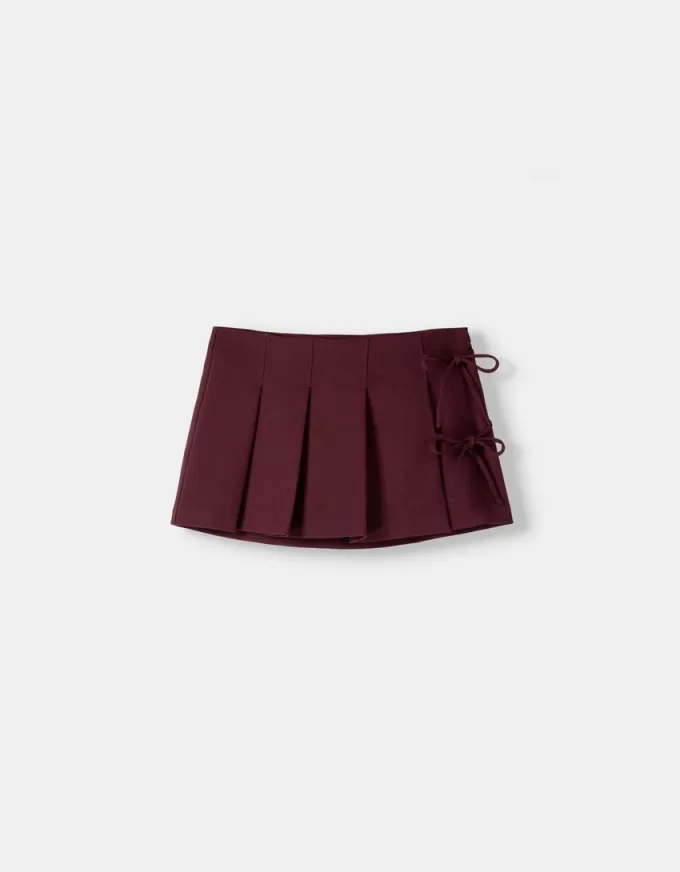 Box pleat mini skirt with bow detail Box pleat mini skirt with bow detail