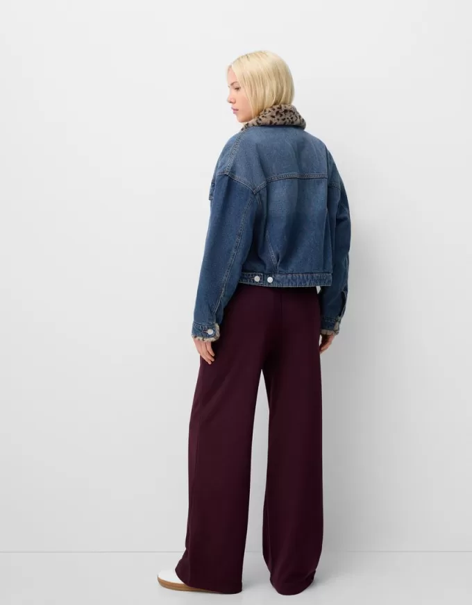 Denim jacket with animal print faux fur collar