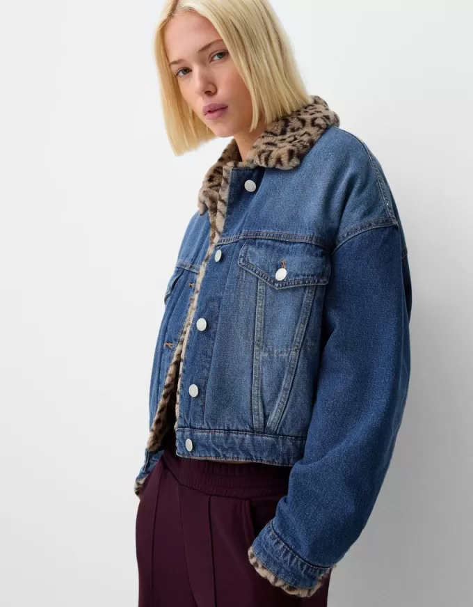 Denim jacket with animal print faux fur collar