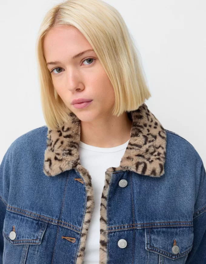 Denim jacket with animal print faux fur collar