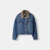 Denim jacket with animal print faux fur collar