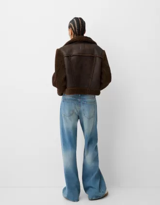 Double-sided jacket with faux shearling sleeves