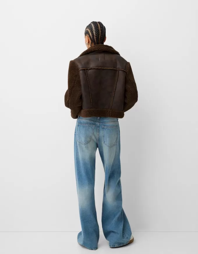 Double-sided jacket with faux shearling sleeves