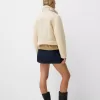 Double-sided jacket with faux shearling sleeves