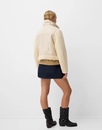 Double-sided jacket with faux shearling sleeves