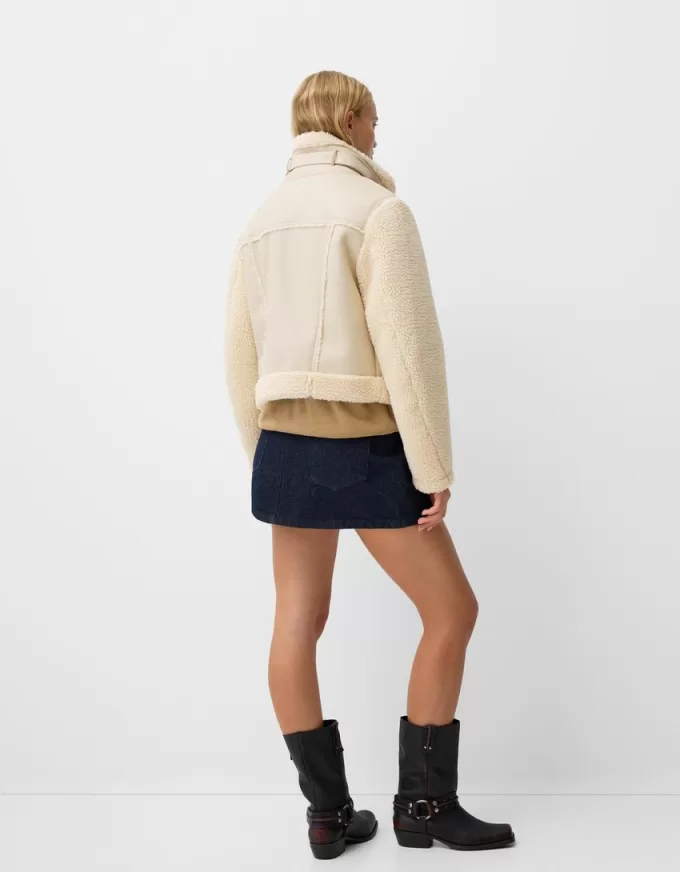 Double-sided jacket with faux shearling sleeves