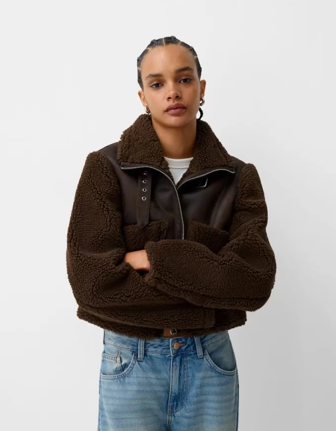 Double-sided jacket with faux shearling sleeves