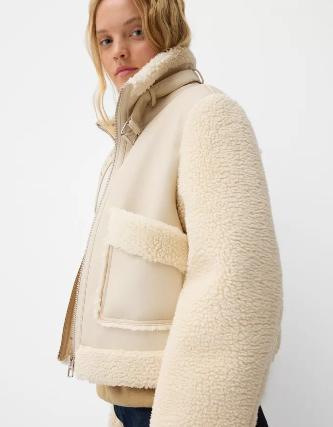 Double-sided jacket with faux shearling sleeves