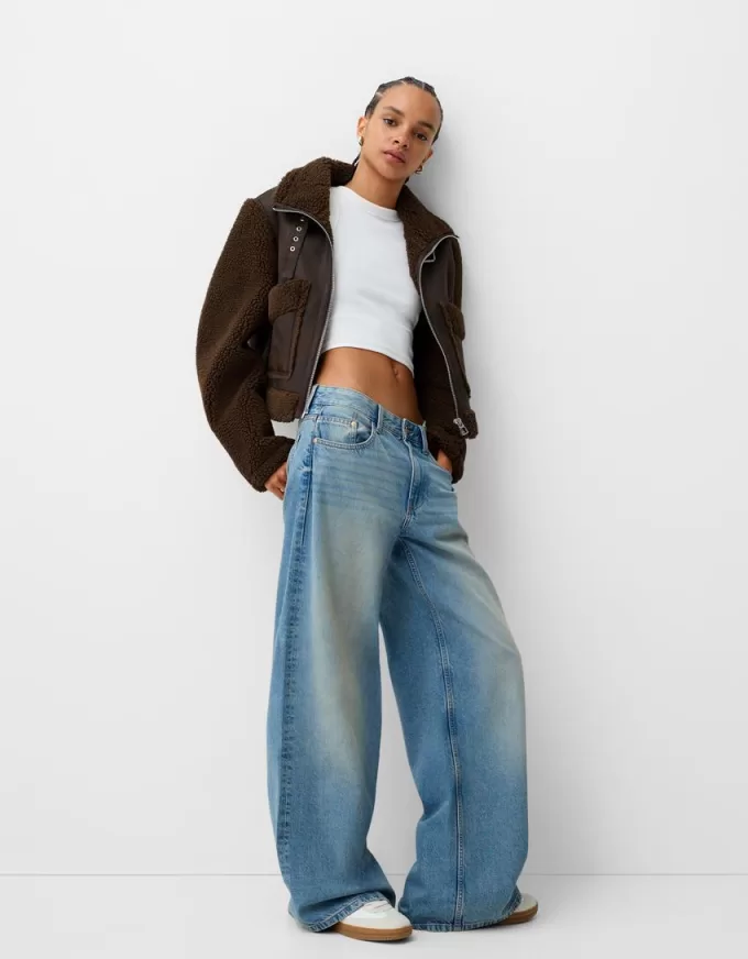 Double-sided jacket with faux shearling sleeves