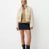 Double-sided jacket with faux shearling sleeves