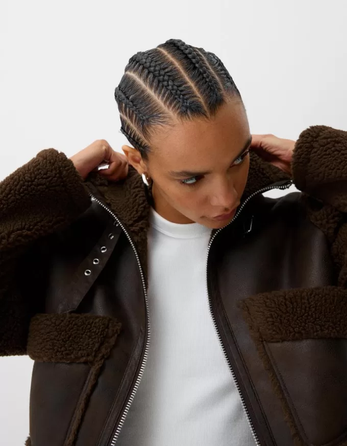 Double-sided jacket with faux shearling sleeves