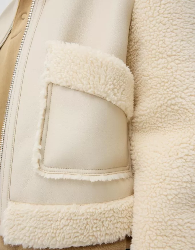 Double-sided jacket with faux shearling sleeves