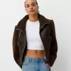 Double-sided jacket with faux shearling sleeves