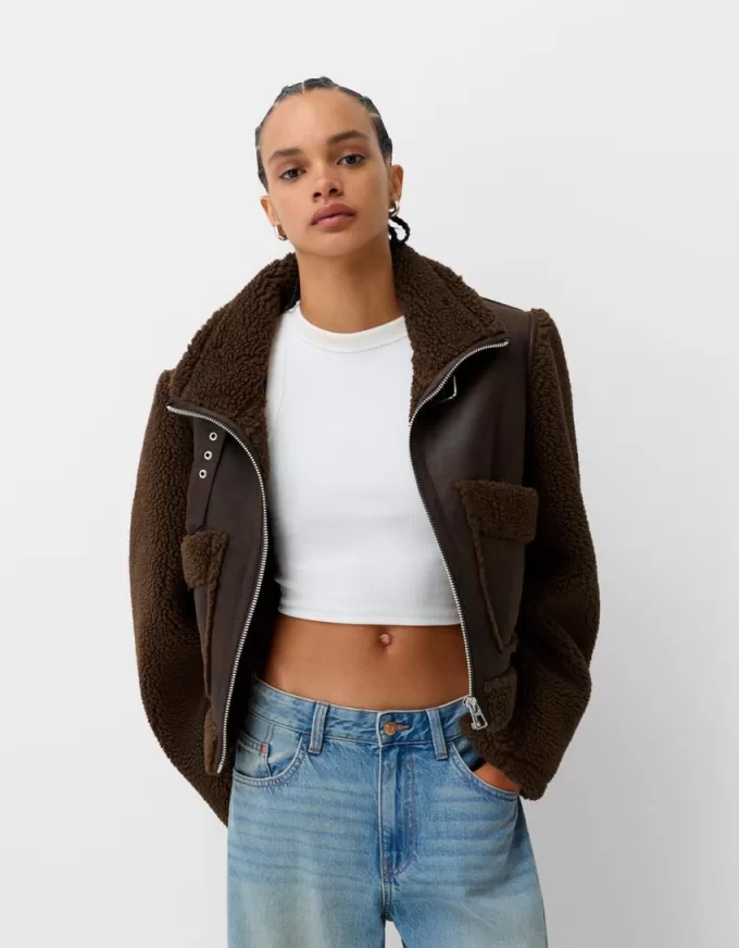 Double-sided jacket with faux shearling sleeves