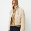 Double-sided jacket with faux shearling sleeves