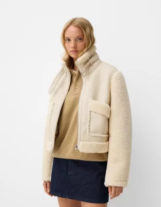 Double-sided jacket with faux shearling sleeves