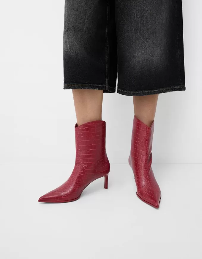 Embossed animal print heeled ankle boots