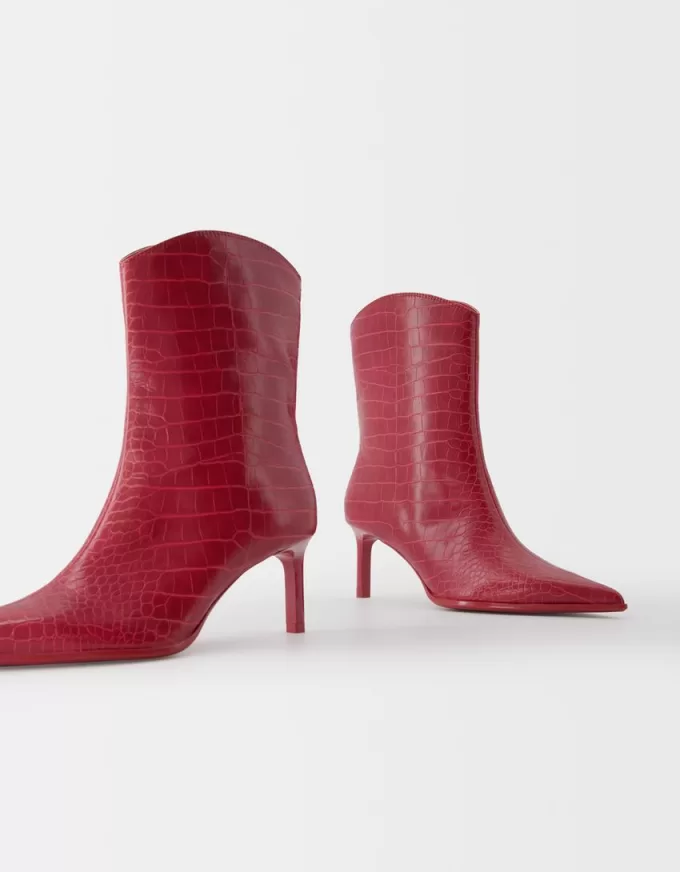 Embossed animal print heeled ankle boots