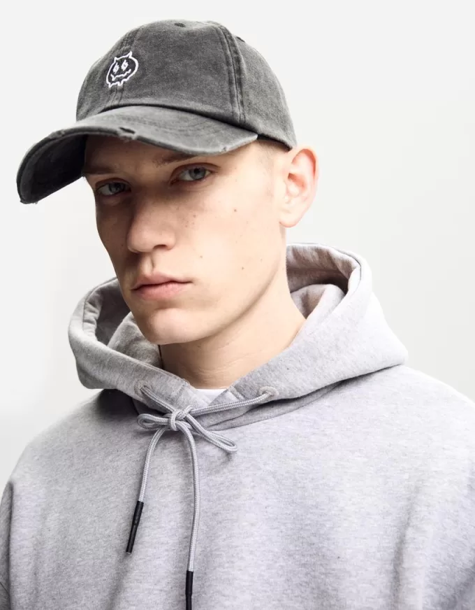 Embroidered ripped cap