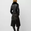 Fitted leather effect jacket with a sweatshirt material neck
