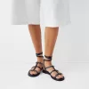 Flat sandals with ring details Flat sandals with ring details