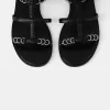 Flat sandals with ring details Flat sandals with ring details