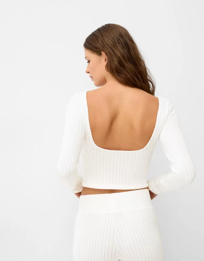 Long sleeve cable-knit sweater with open back