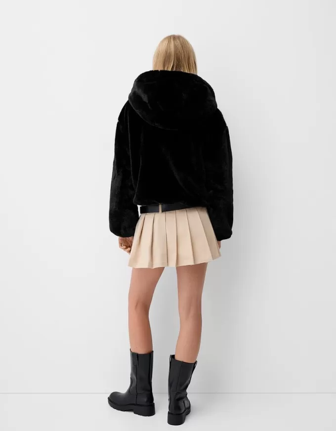 Quilted jacket with faux fur hood