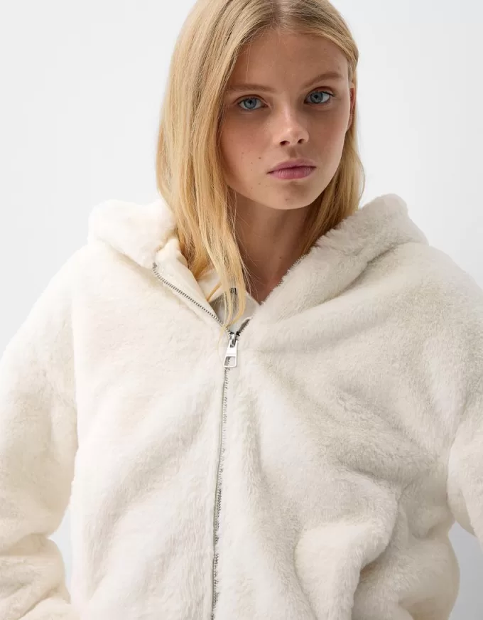 Quilted jacket with faux fur hood