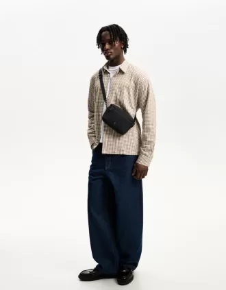 Rubberized monogram messenger bag