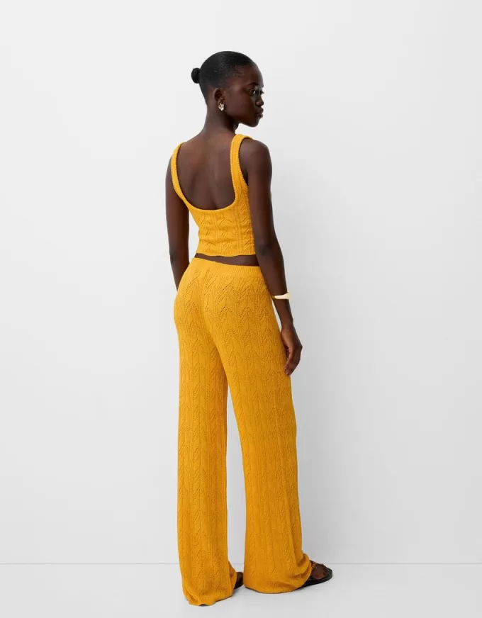 Rustic open knit flared pants