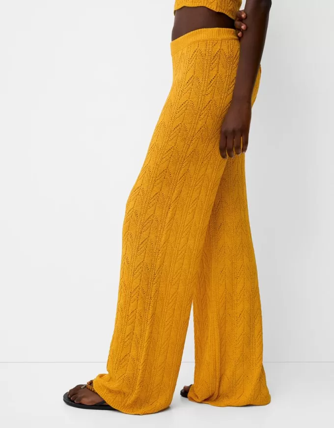 Rustic open knit flared pants