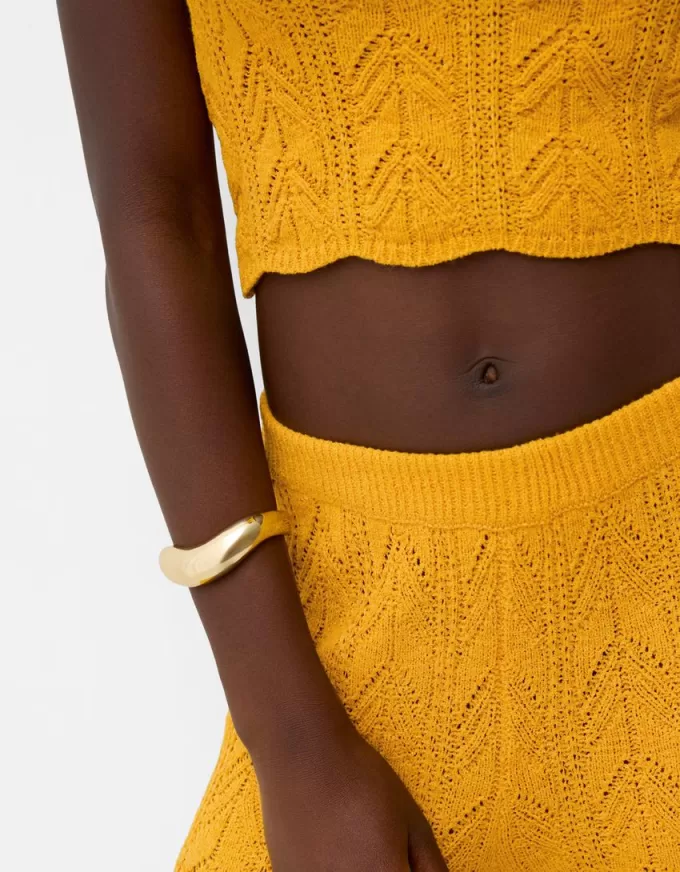 Rustic open knit flared pants