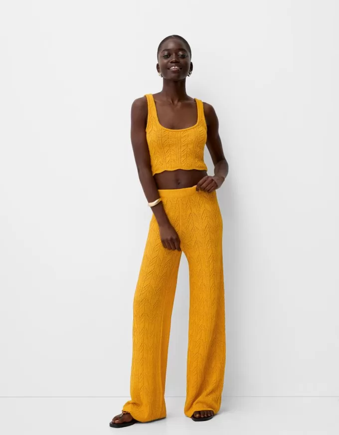 Rustic open knit flared pants