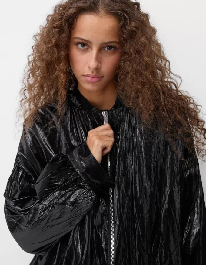 Shiny effect bomber jacket with over print