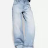 Wide-leg ’90s jeans with turn-up hems Wide-leg ’90s jeans with turn-up hems