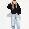 Wide-leg ’90s jeans with turn-up hems Wide-leg ’90s jeans with turn-up hems