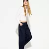 Wide-leg ’90s jeans with turn-up hems