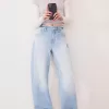 Wide-leg ’90s jeans with turn-up hems Wide-leg ’90s jeans with turn-up hems
